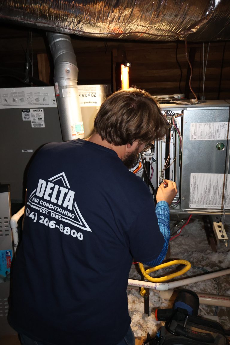 Delta Tech Working on HVAC Unit